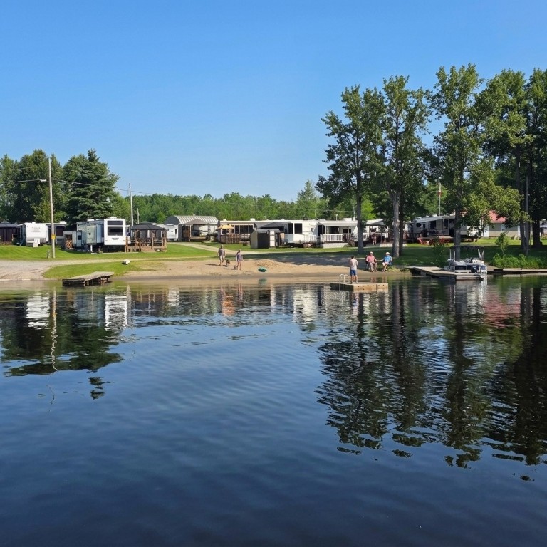 Sandy beach on a summer day at Victoria Lodge on Lake Nipissing